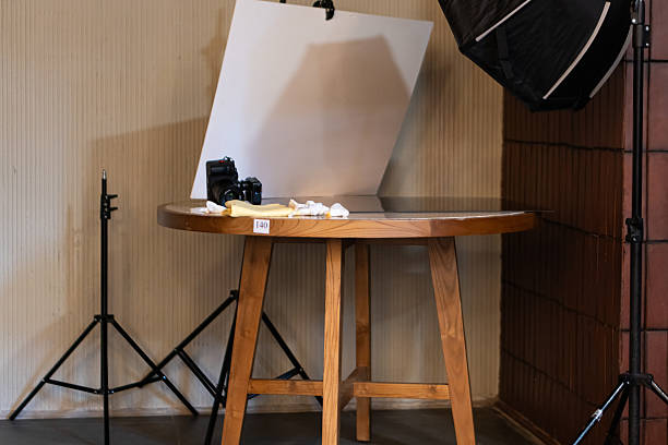 istock Photography Setup with Wooden Round Table and Camera 2210885911
