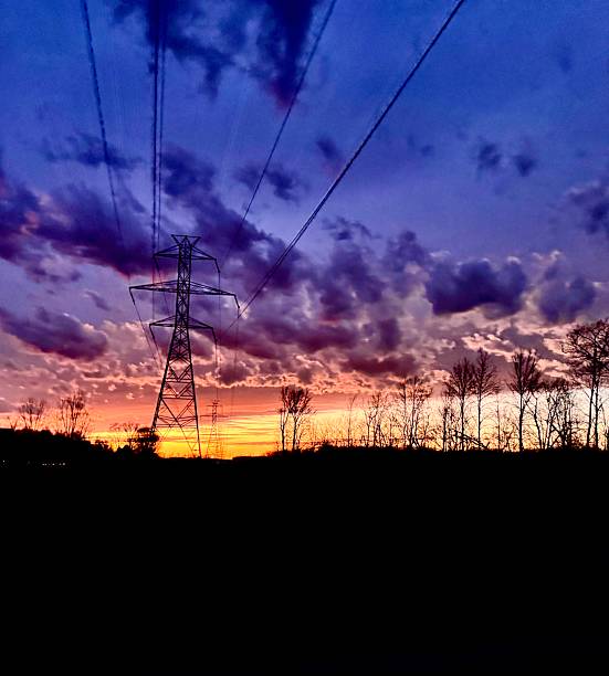 istock Purple Power Lines Sunset 2210886498
