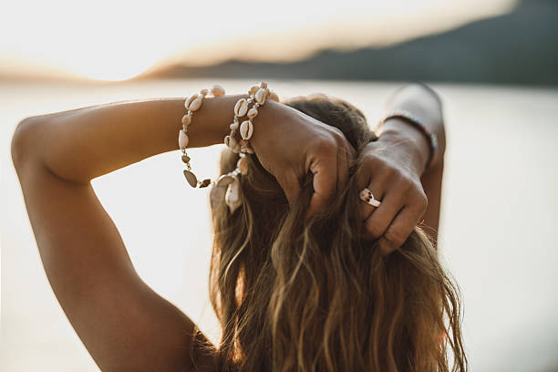 istock Woman Enjoy Sunset At The Beach 2210887295