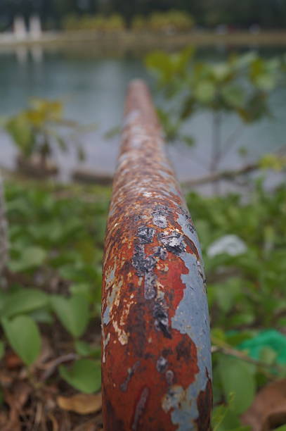 istock rusty iron rods in public places. Broken and rusted pipes. 2210887946