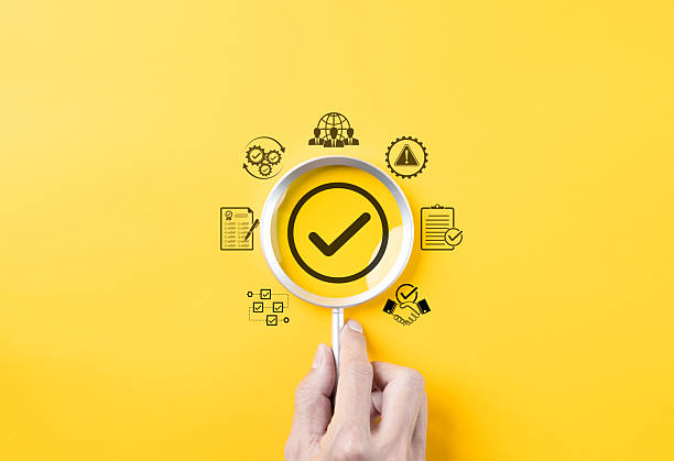 istock Quality assurance and compliance certification concept. Magnifying glass focusing on checkmark with quality, checklist, and compliance icons, assurance, verification, and quality management processes. 2210888782