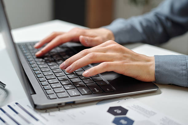 istock Female Hands Typing on Keyboard in Office 2210892911