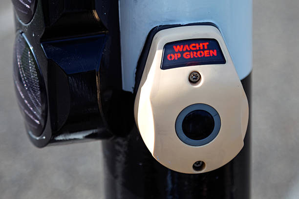 A close-up of a pedestrian crossing button, showing the message \