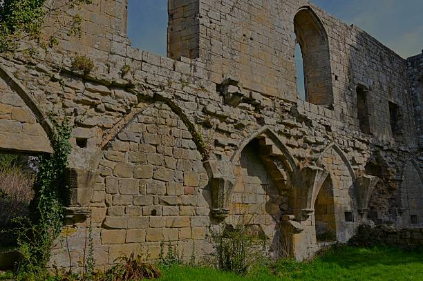 An exterior view of the ruined Jervaulx Abbey church building in Yorkshire in England.