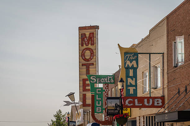 Shelby, MT, US-July 10, 2021: Main street in small town with vintage neon signs.