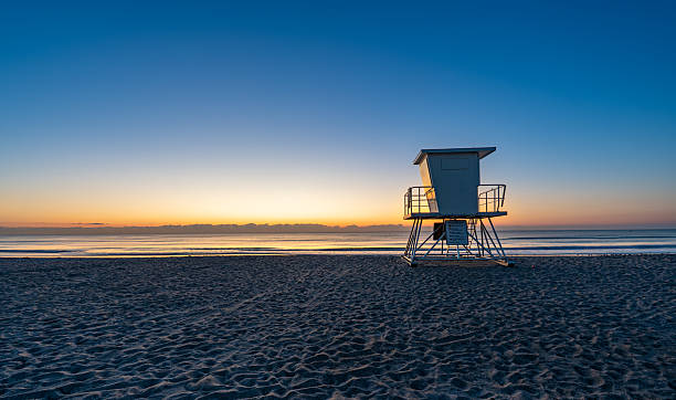 istock Lifeguard Stand on the Beach During a Vibrant Spring Sunrise at Cocoa Beach in Central Florida USA 2210899501