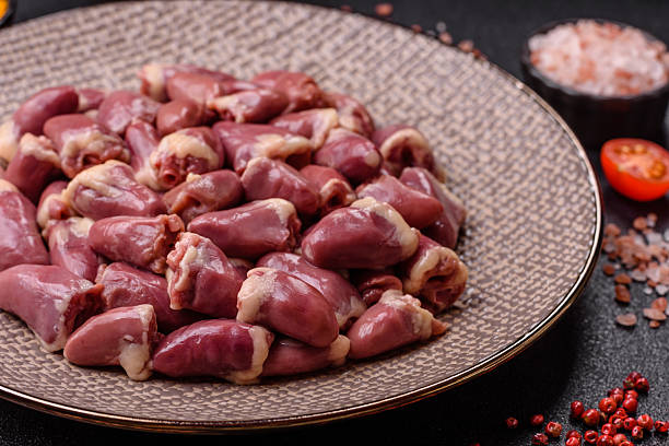 istock Chicken raw heart, red duck or turkey internal organs as an ingredient 2210900522