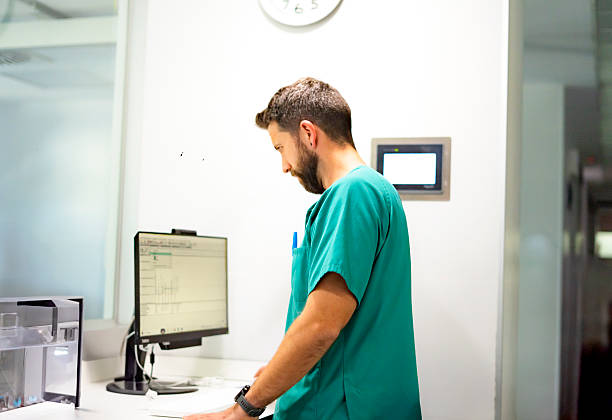 istock Veterinarian reading medical report on desktop computer in clinic laboratory 2210901721