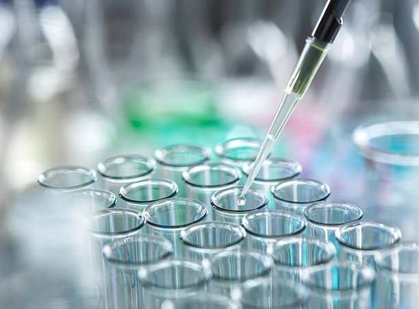istock A precise scientist using a pipette to carefully administer a liquid into test tubes. 2210902868