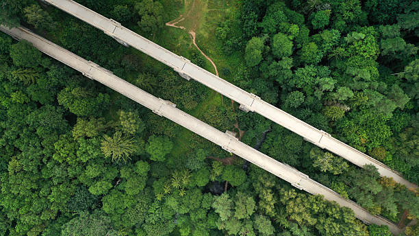 istock Aerial view of old stone train bridge in the forest 2210903996
