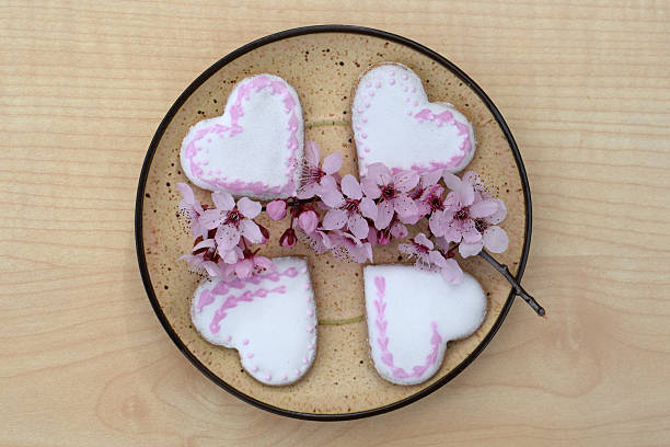 istock Plate with romantic decorated gingerbread cookies 2210911281