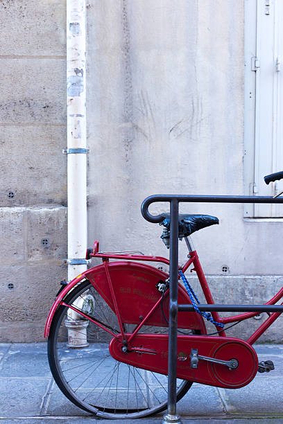 istock Paris, France: Red Bike, Ile Saint-Louis, White Wall Background 2210916773