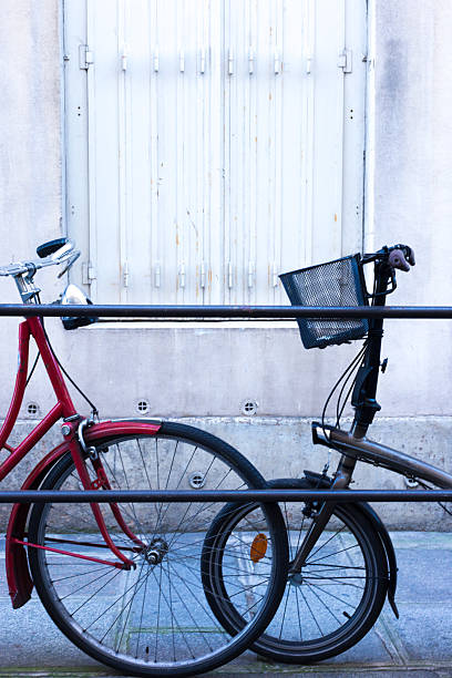 Paris, France: Two Bikes, Ile Saint-Louis, White Wall Background