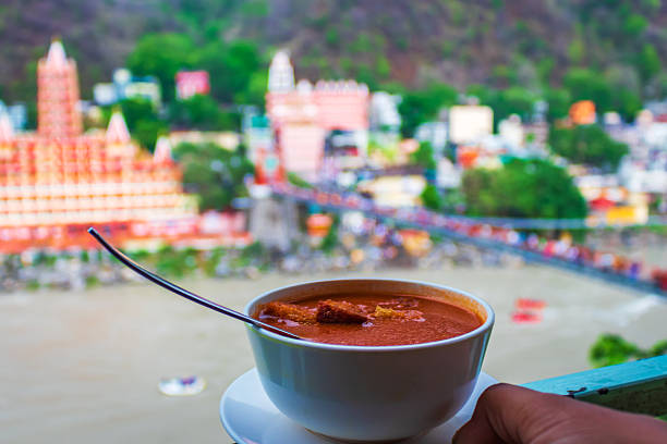 Hot Soup in Focus with Lakshman Jhula Bridge in Background – Rishikesh, India