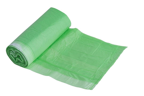 istock Green garbage bag isolated on white background. 2210928337