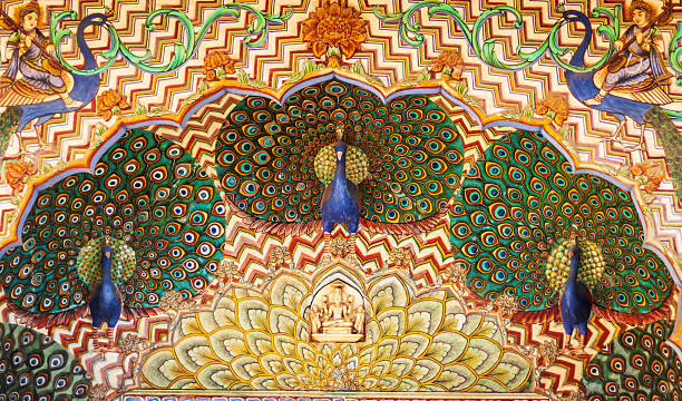 Close-up detail of a richly decorated ceiling panel, likely from a palace in Rajasthan, India.