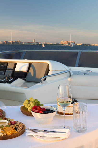 istock Enjoy an Elegant Dining Experience on a Luxurious Yacht during a Stunning Sunset 2210930832