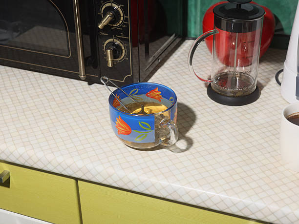 istock A Colorful Tea Cup resting elegantly on the Kitchen Counter among various Appliances 2210941585