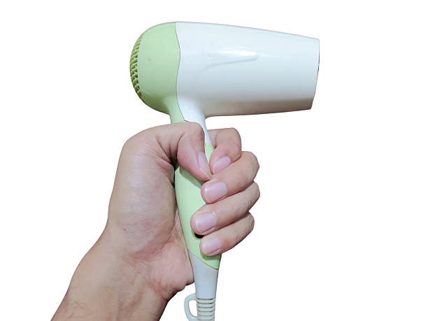 istock A hand holding a compact electric hair dryer 2210945152