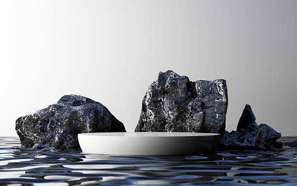 istock White podium sits amid sharp black rocks and blue-tinged water, forming a striking contrast in a modern design. 3d rendering. 2210951915