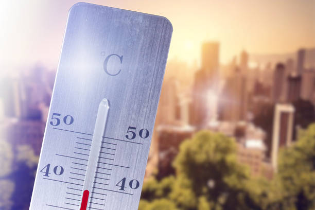 istock A hot summer in a town and a thermometer 2210952228