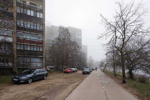 Riga, Latvia - April 13, 2025: Kengarags buildings next to the Daugava river in the morning fog