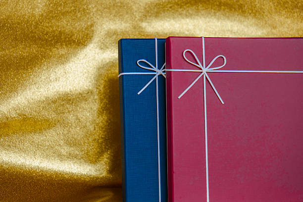 istock Colorful Wrapped Gifts on Gold Background 2210957387