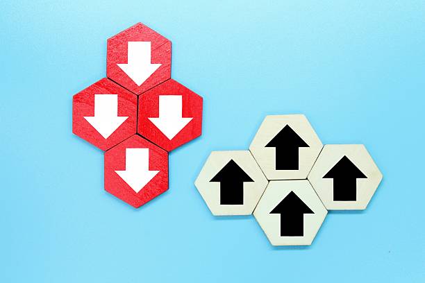 istock colored wooden hexagons with down and up arrows. Different ways or direction 2210958053