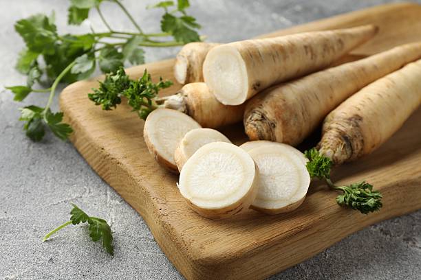 istock Parsley roots and leaves on grey table, closeup 2210960629