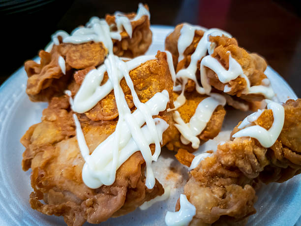 istock Deep-Fried Chicken pieces with yellow Seasoning and Mayonnaise 2210960669