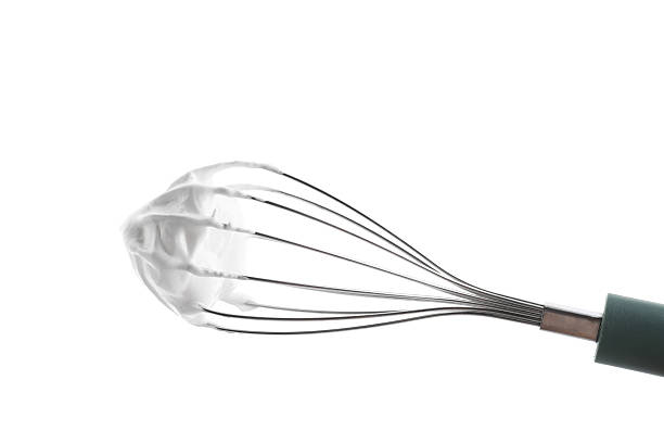 istock Whisk with delicious cream isolated on white 2210961051