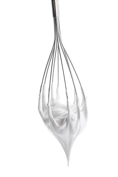 istock Whisk with delicious cream isolated on white 2210961058