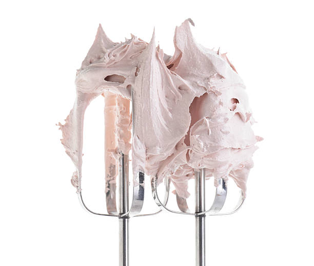 istock Hand mixer with delicious cream isolated on white 2210961064