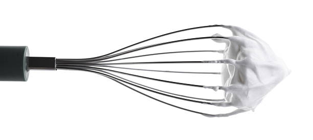 istock Whisk with delicious cream isolated on white 2210961070