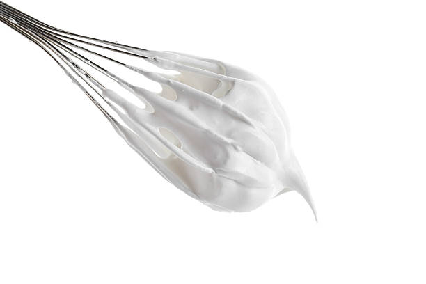 istock Whisk with delicious cream isolated on white 2210961071