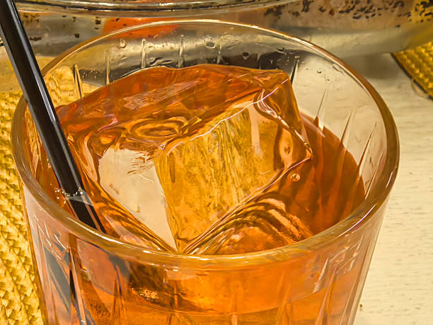 Refreshing drink with ice in a cozy setting captures the essence of relaxation