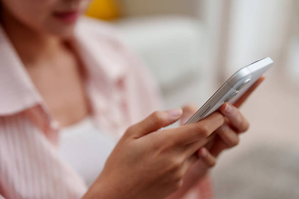 istock Staying connected while working from home is essential for productivity and well being. This captures person engaged with their smartphone, highlighting blend of technology and dailyfreeelance 2210962330