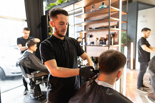 istock Busy day in a barber shop 2210963664
