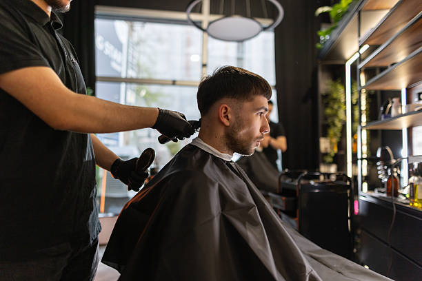 istock Young male client in a barber shop 2210963686
