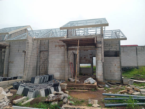 istock Unfinished House Structure with Exposed Roof Frame 2210963729