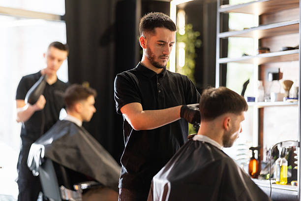 istock Busy day in a barber shop 2210963745