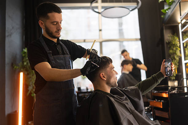 istock Young man having video call during hair cutting 2210963765