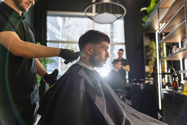 istock Young male client in a barber shop 2210964034