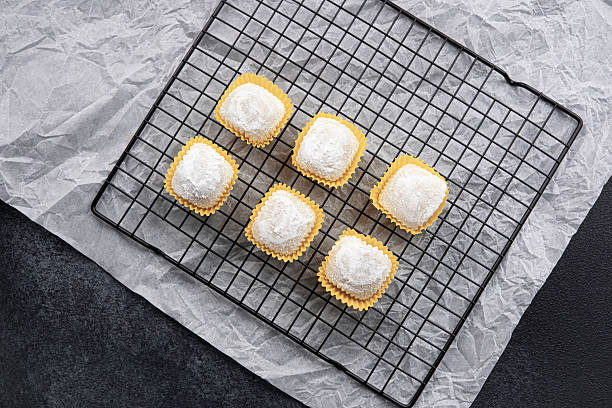 istock Delicate coconut confections cooling on a wire rack in a kitchen 2210964320