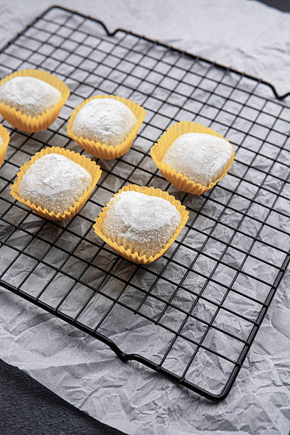 istock Baked dessert treats cooling on a wire rack in a cozy kitchen setting 2210964322