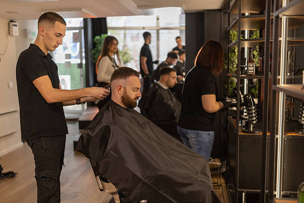 istock Busy day in a barber shop 2210964381
