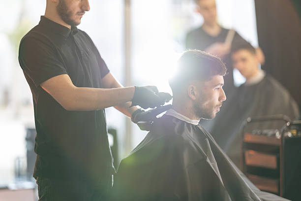 istock Young male client in a barber shop 2210964437