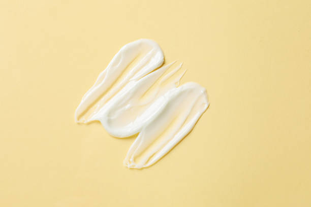 istock Sample of body cream on beige background, top view 2210966606