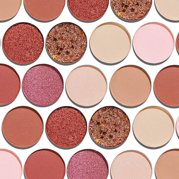 istock Cosmetics texture pattern, Warm vivid colored eye shadow makeup palette, round eye powder swatches. Female cosmetic and beauty products, aesthetic minimal beauty photo, colorful eyeshade, top view 2210967888