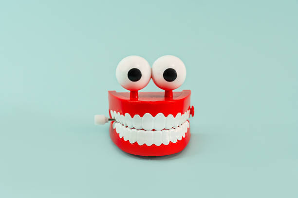 istock A jaw toy with teeth and eyes on a blue background 2210970521